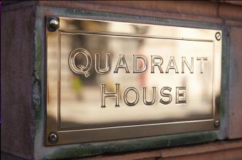 Gold plaque saying Quadrant House