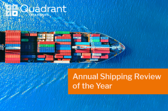 Shipping container sailing across a blue sea